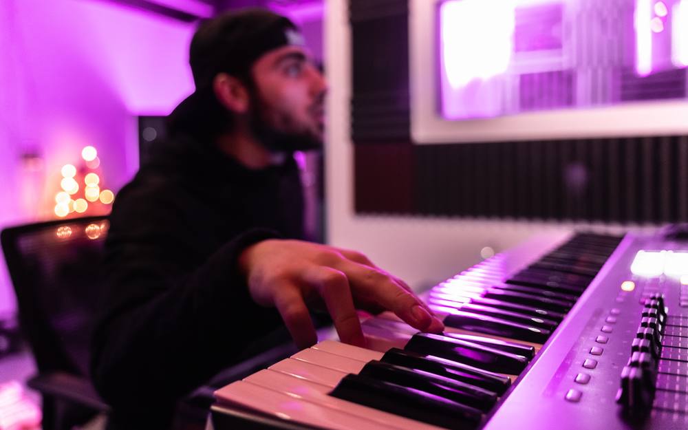 Tony Lillick playing keys in the studio